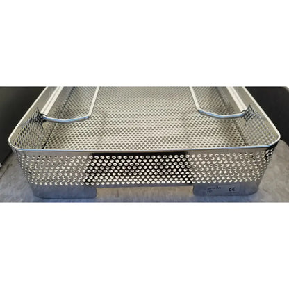 Stainless steel perforated surgical instrument basket with reinforced handles and labeled base in genesis carefusion sterilization container