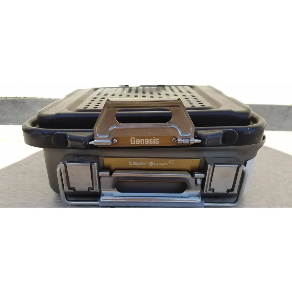 Dark gray rugged plastic genesis carefusion sterilization container with gold metal latch and handle by v.mueller