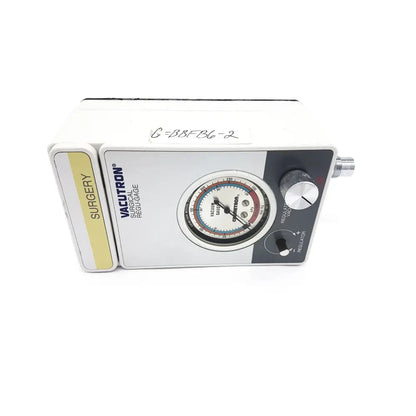 White Vacutrol Health Care surgical vacuum regulator with circular gauge and silver control knobs for health care surgical use