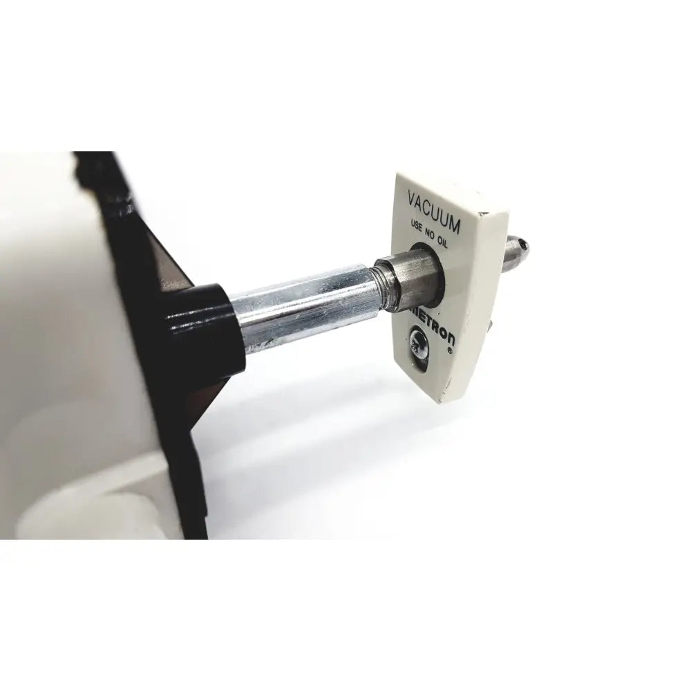 White metron vacuum valve with metallic shaft and black plastic housing for vacutrol health care sugrical product untested