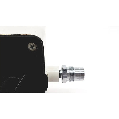 Chrome-finished threaded connector attached to white plastic fitting on black housing of vacutrol health care sugrical regu-gage