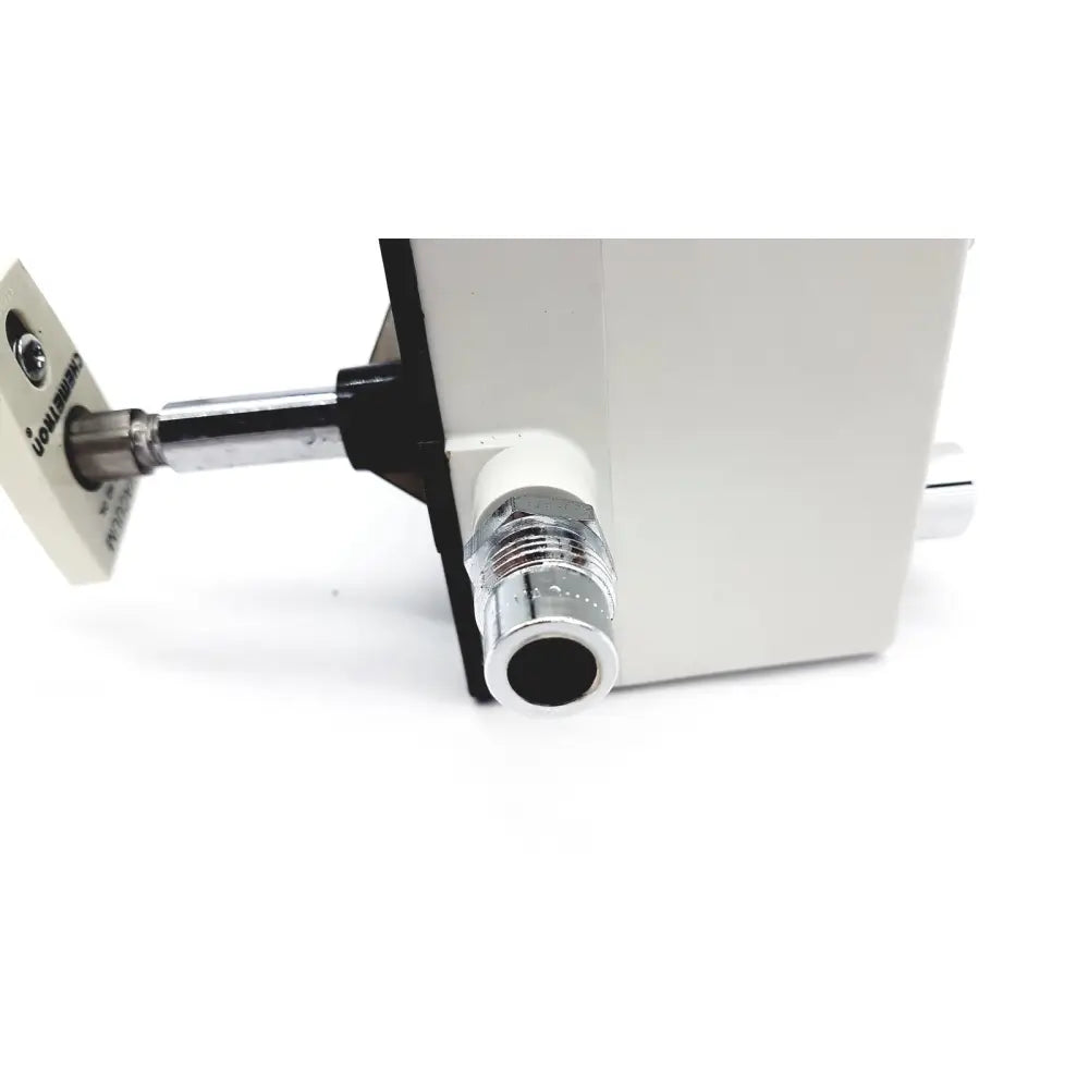 White vacutrol health care surgical device with chrome threaded port and black bracket labeled local innovations back view