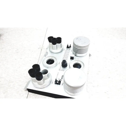 White and black vaisala hmk15 humidity calibrator with multiple lenses, adjustable knobs, and measurement scale for probes