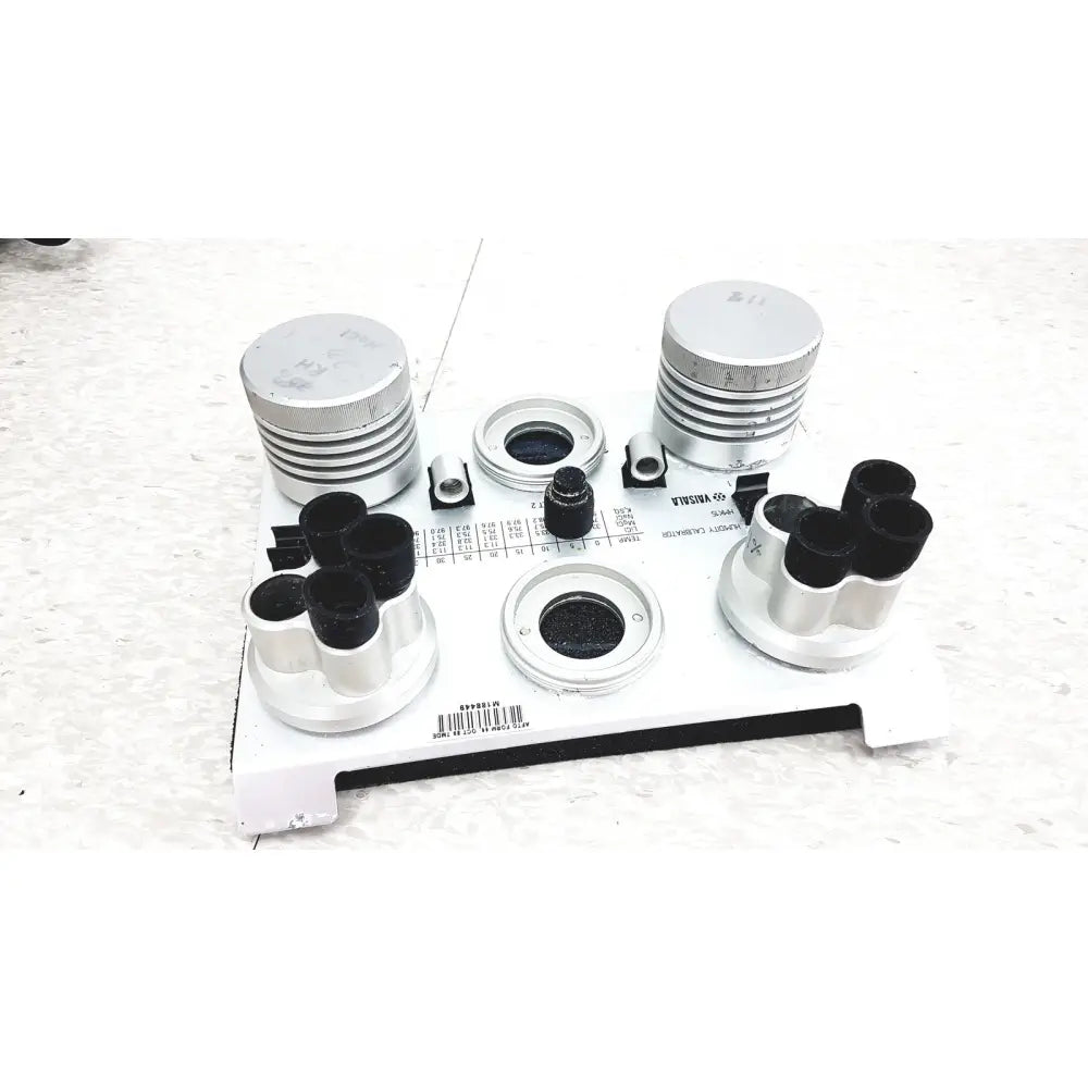 Vaisala hmk15 humidity calibrator with silver metallic optical test kit and black rubberized components on white base