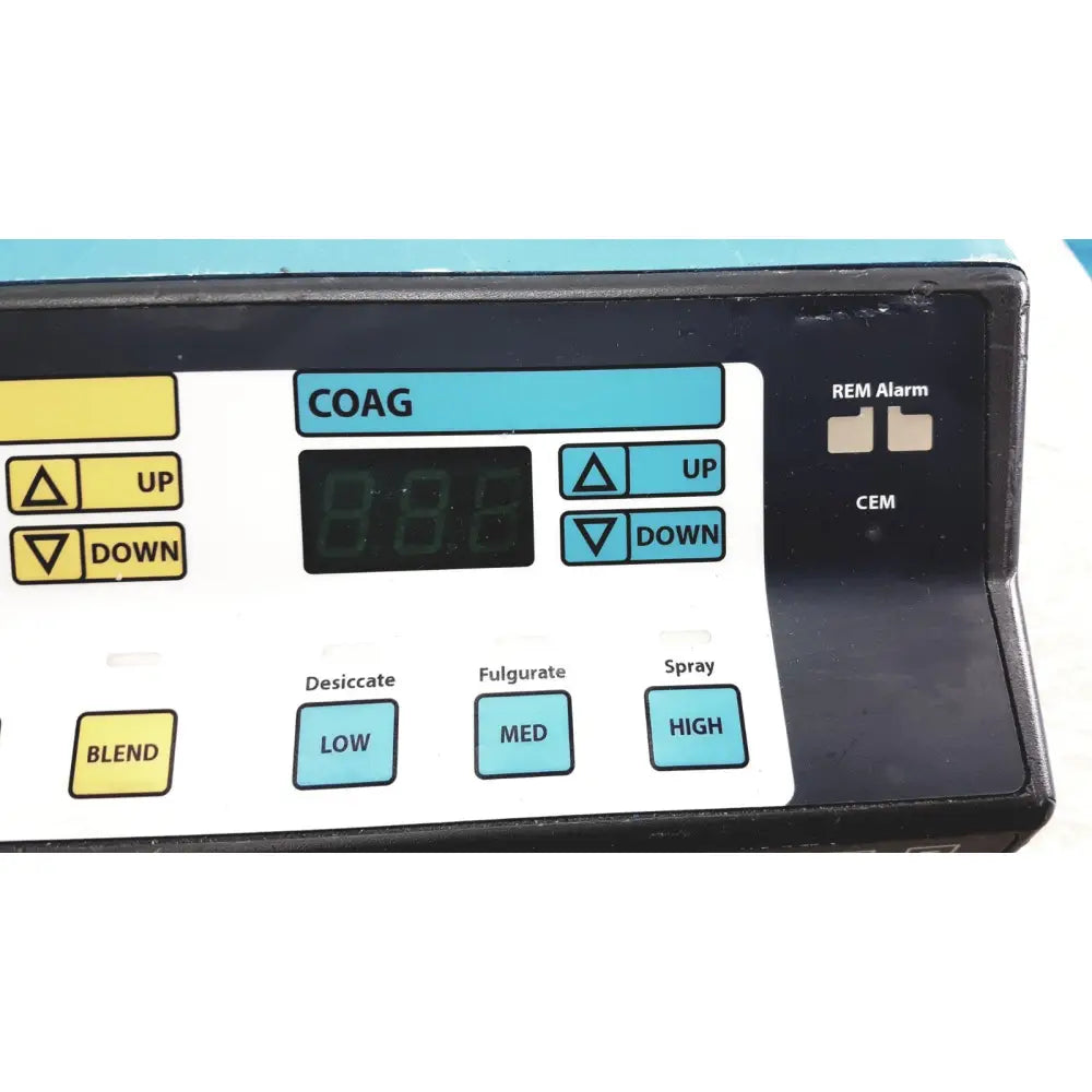 Black and white valleylab force electrosurgical unit control panel with teal foot pedal buttons for surgical functions