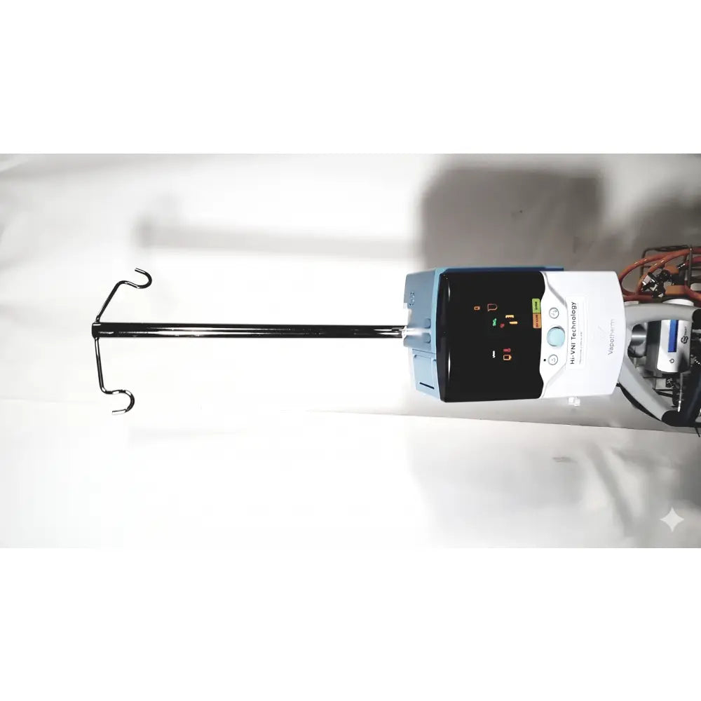 White and light blue medtronic iv pump with black display connected to tubing showing technology precision flow plus features
