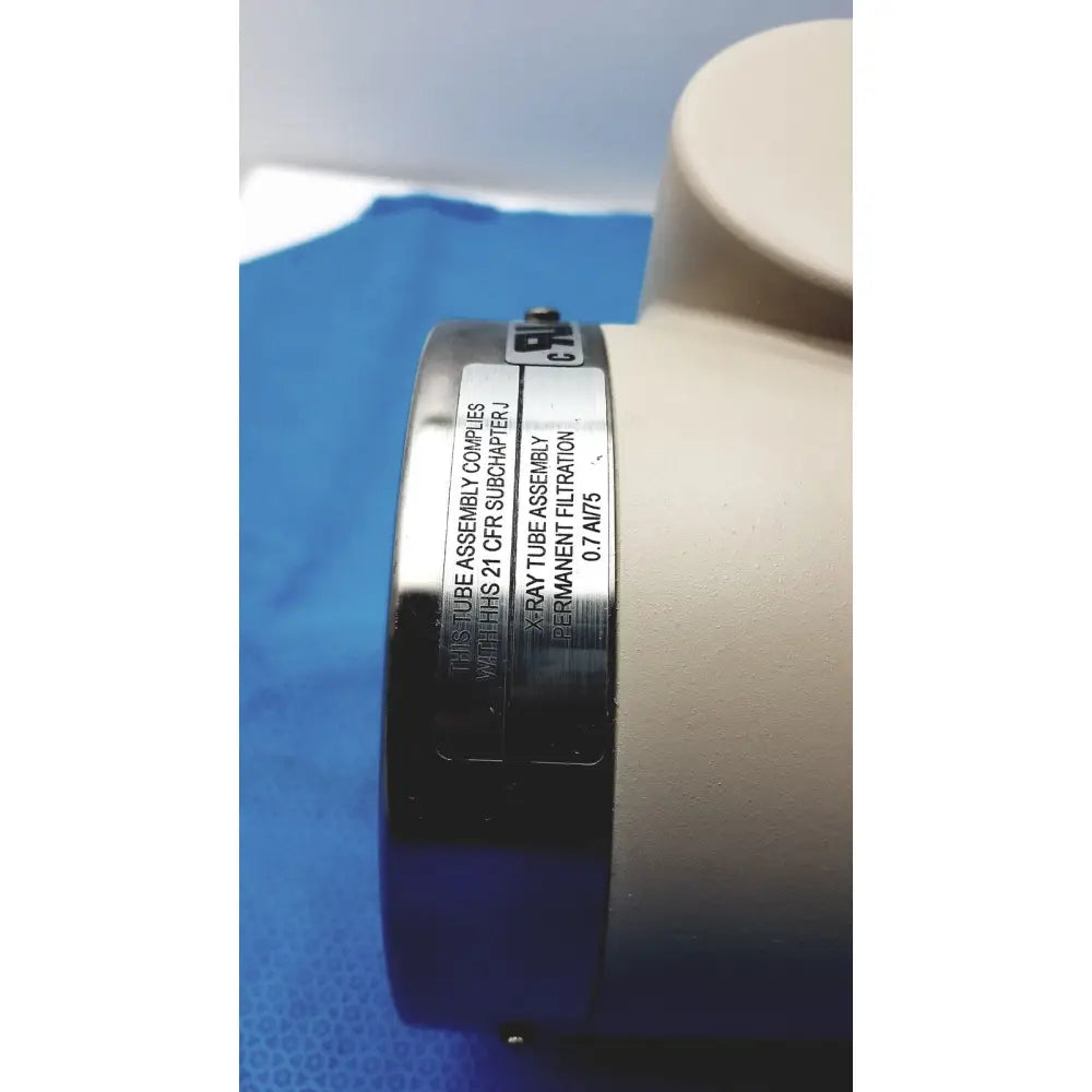 Silver metallic cylindrical varian rad-60 tube with engraved text and white plastic housing for reuse medical filtration