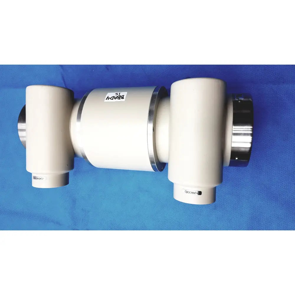White cylindrical varian rad-60 tube with metallic silver rings labeled bapd 31 on blue surface for reuse medical parts