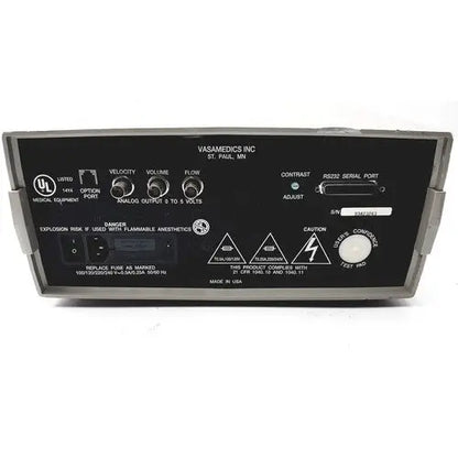 Black plastic vasamedics laserflo blood perfusion monitor back panel with silver knobs serial port and warning labels