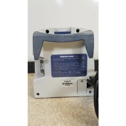 White and gray venaflow elite aircast dvt vascular pump with blue label showing model information for dvt treatment