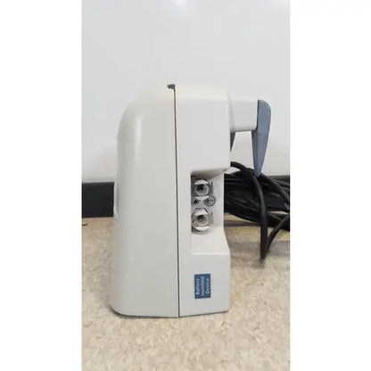 White plastic venaflow 120508 elite aircast dvt vascular pump system with gray handle and three silver knobs on the side