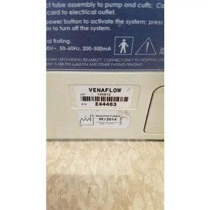 Beige plastic venaflow elite aircast dvt vascular pump system with barcode label and serial number visible on back side