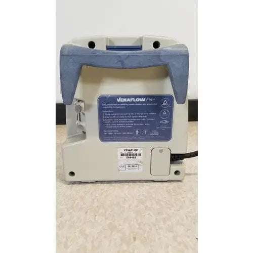 Beige and blue plastic venaflow elite aircast dvt vascular pump system with power cord attached
