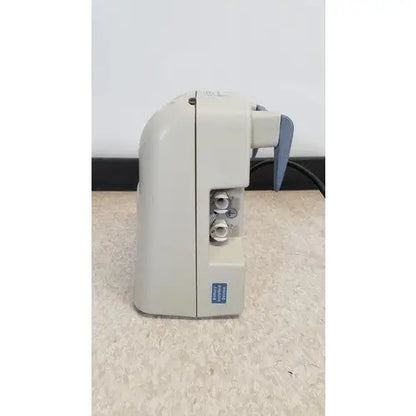 Beige plastic dental handpiece with blue handle and silver metallic parts in venaflow elite aircast dvt vascular pump system