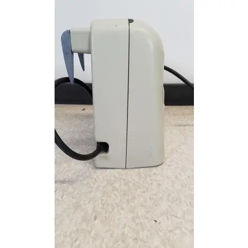 Beige plastic venaflow elite aircast hand mixer with black cord and blue accents for aircast dvt vascular use