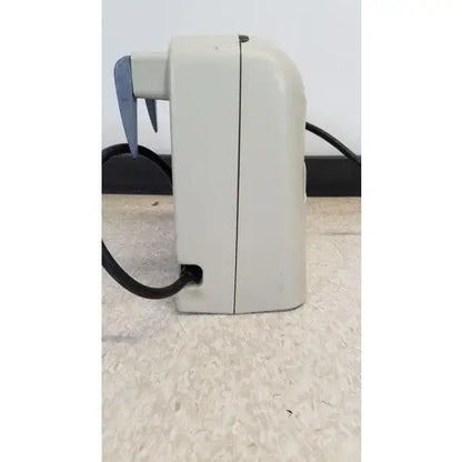 Beige plastic venaflow elite aircast hand mixer with black cord and blue accents for aircast dvt vascular use