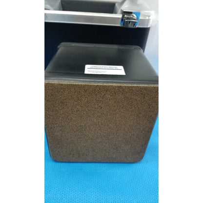Black rectangular verathon bladderscan tissue equivalent bladder phantom with textured brown front panel and white label