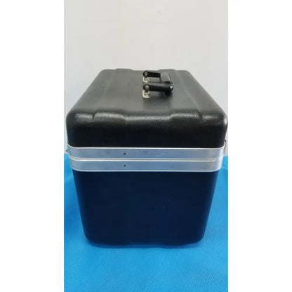 Black and navy blue two-tone hard-shell travel case with silver metal band and handle for Verathon BladderScan tissue equivalent bladder phantom