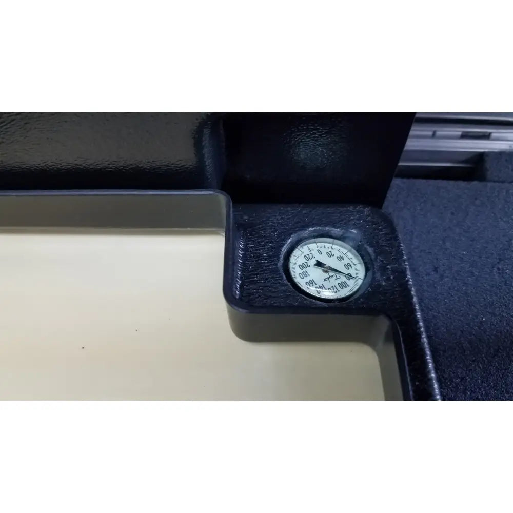 Black pressure gauge with white face and black markings in textured plastic casing for verathon bladderscan tissue equivalent bladder phantom