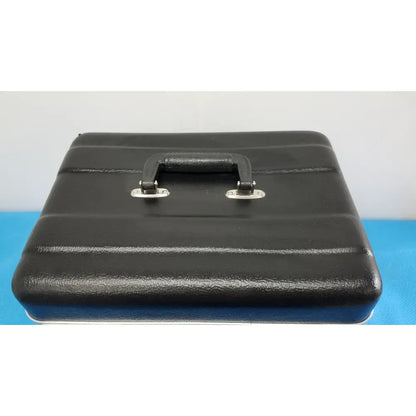 Black textured briefcase with sturdy handle and silver clasps for verathon bladderscan tissue equivalent bladder phantom