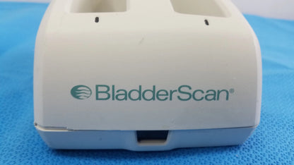 White plastic Verathon BladderScan battery charger with two rectangular slots and front opening for compatible devices