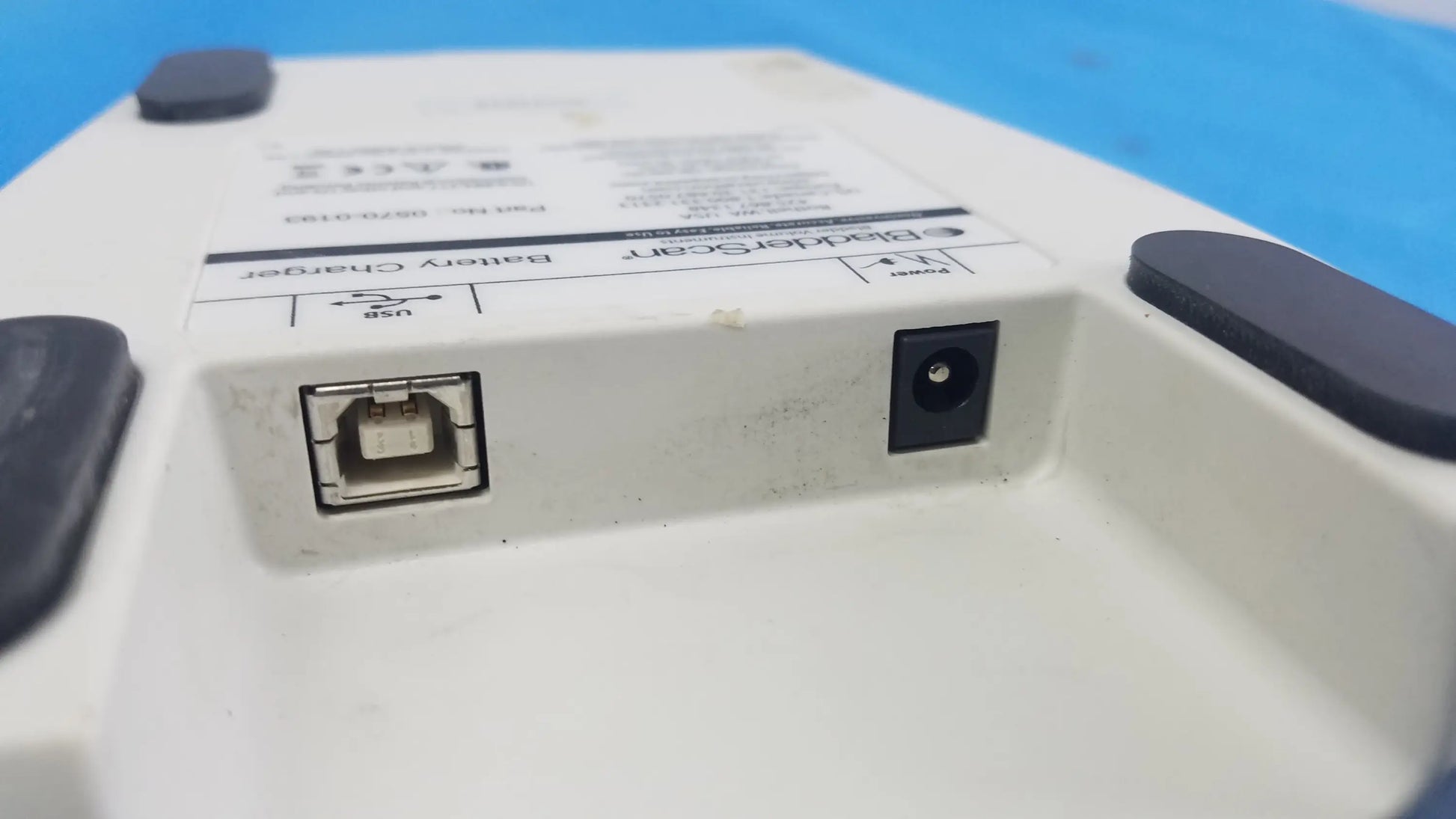 White plastic verathon bladderscan battery charger with black rubber feet and usb port compatible verathon bladderscan