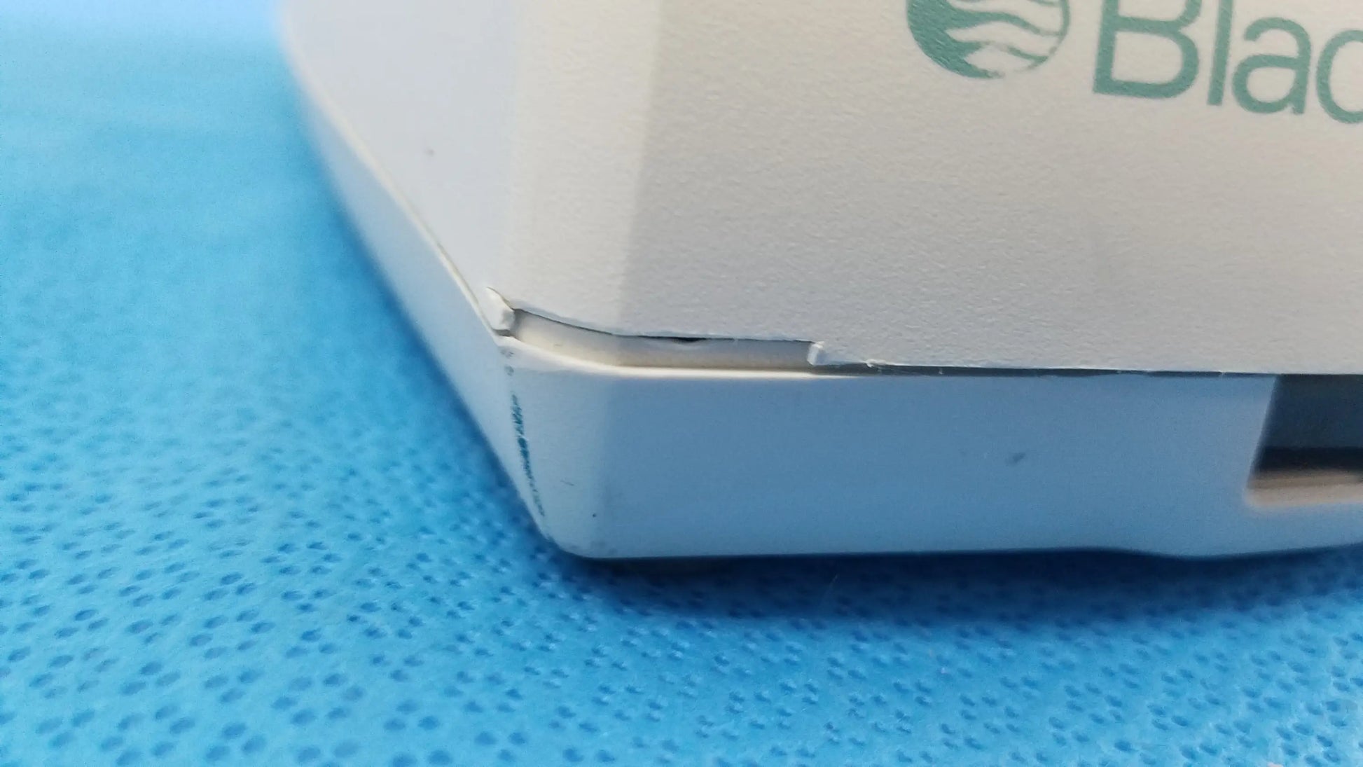 White plastic verathon bladderscan battery charger with green black logo and wave emblem compatible with verathon bladderscan