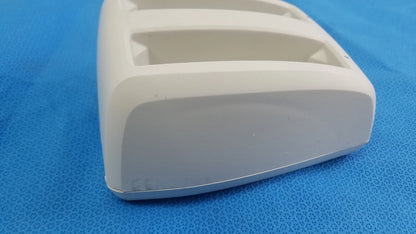 White plastic toothbrush holder with three rectangular slots and rounded edges for compatible verathon bladderscan battery charger p/n 0570-0193