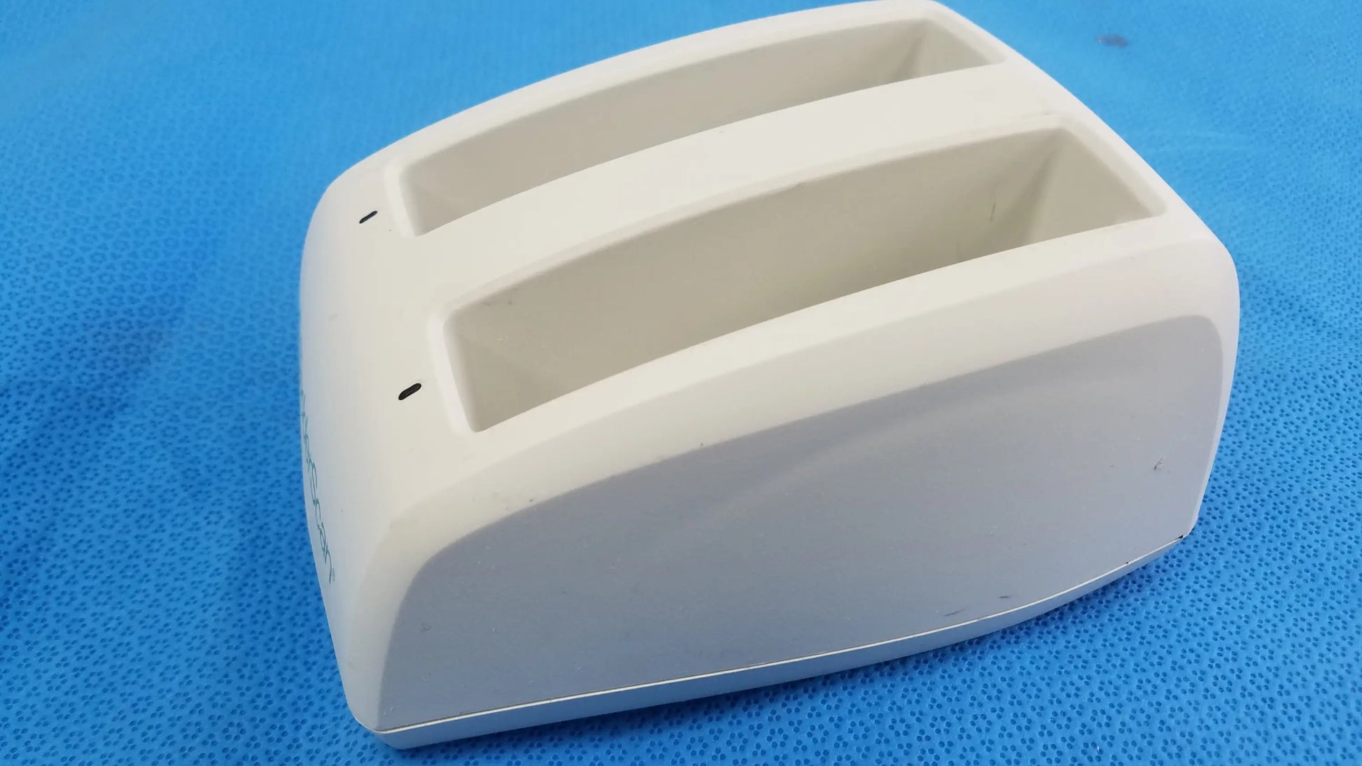 White plastic toaster with two slots and smooth rounded design compatible verathon bladderscan battery charger