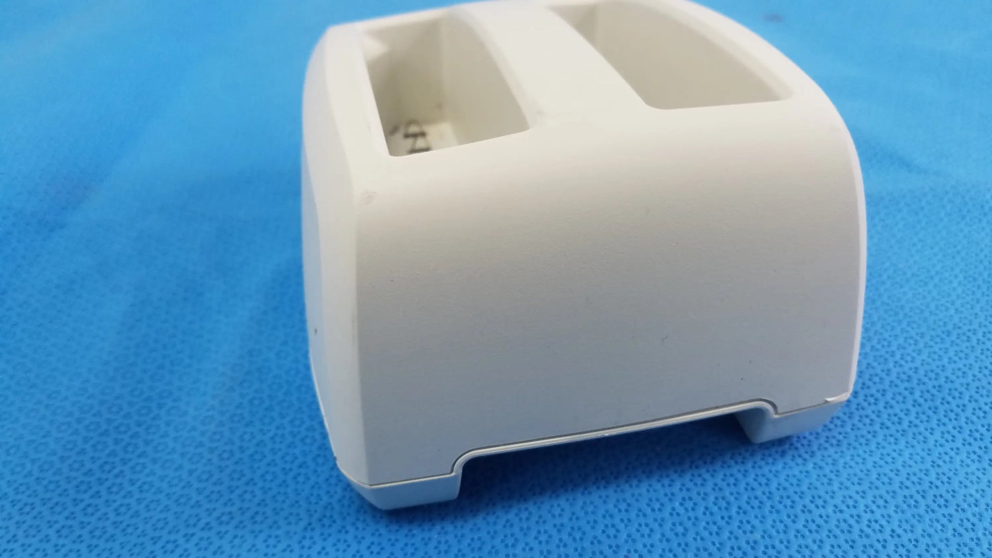 White plastic dual-slot verathon bladderscan battery charger base with rounded edges compatible verathon bladderscan