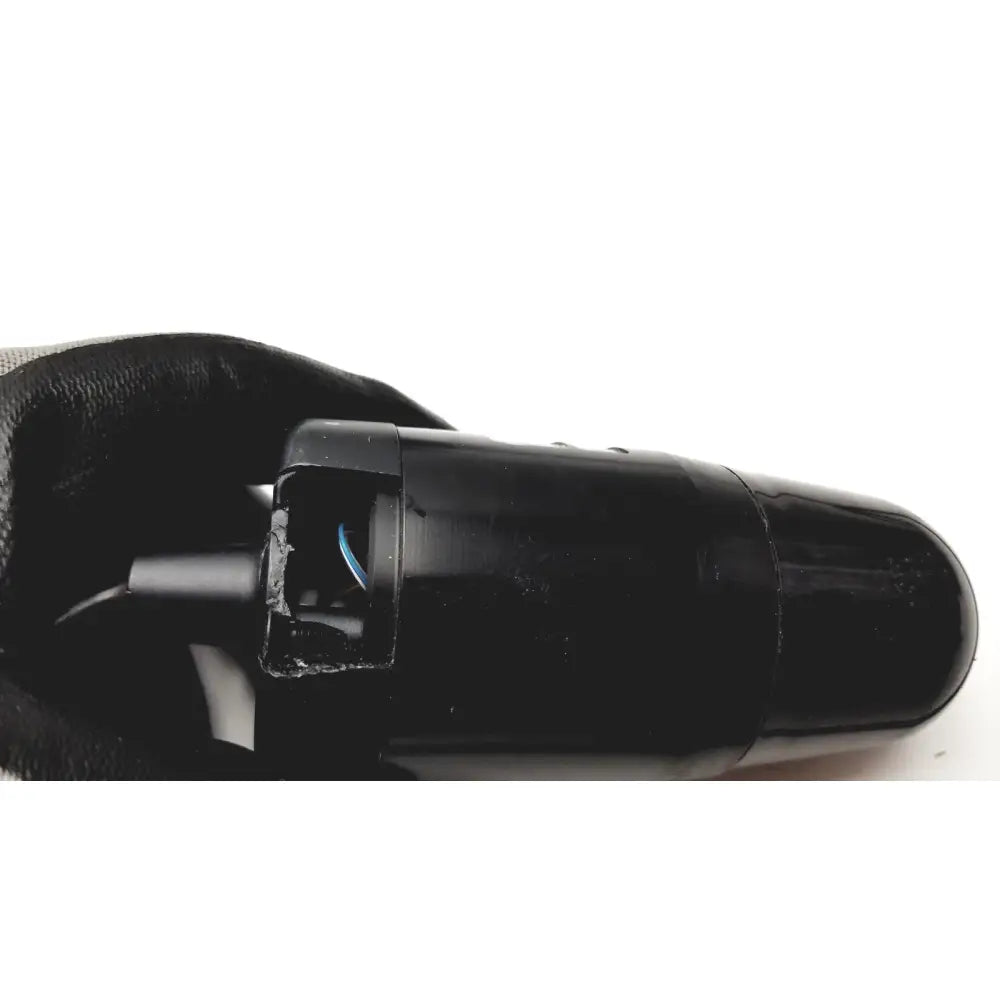 Black plastic cylindrical verathon bladderscan bvi device with cracked casing and exposed internal blue wire for reuse medical purposes
