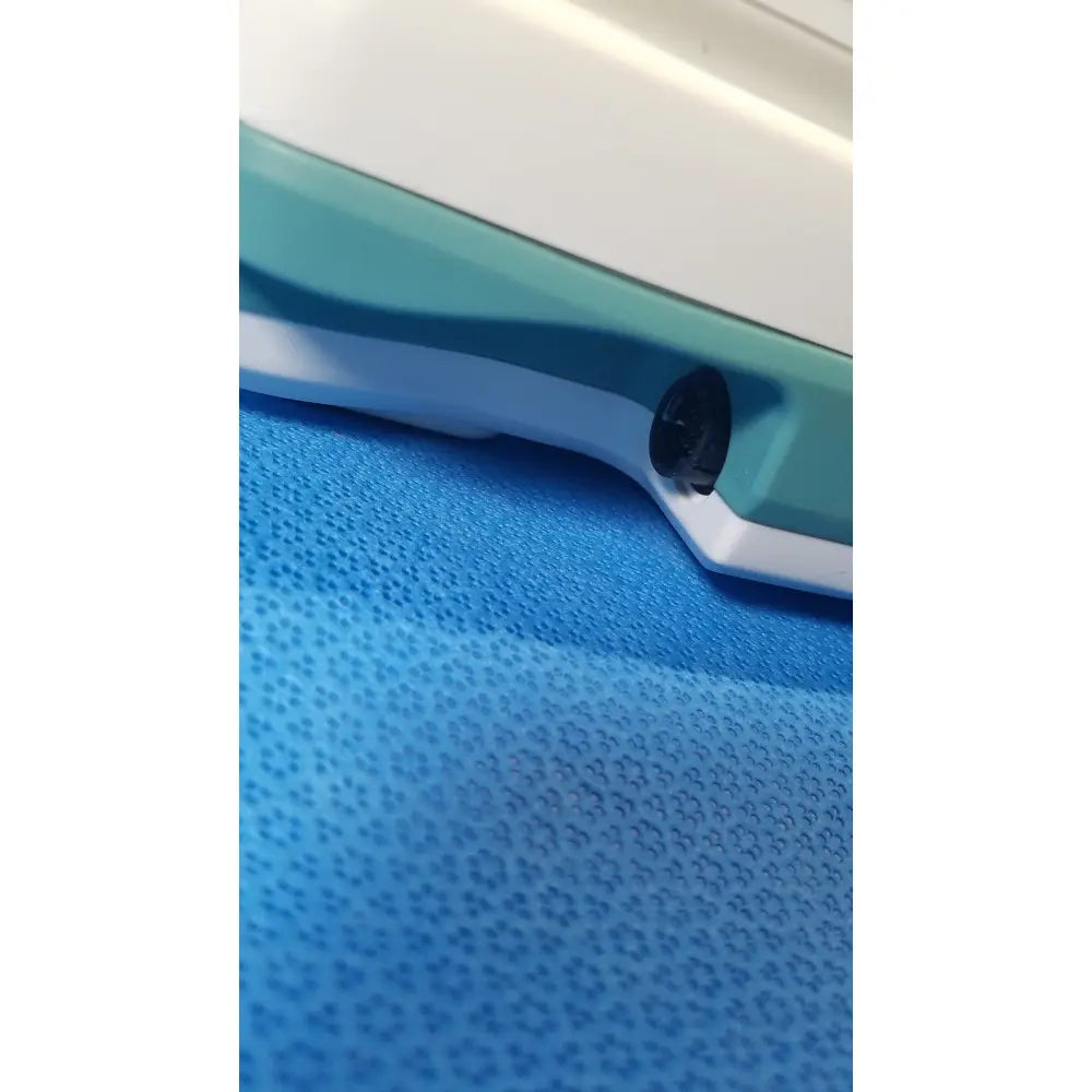 Teal and white verathon bladderscan bvi 9400 portable bladder scanner with black circular port for medical use