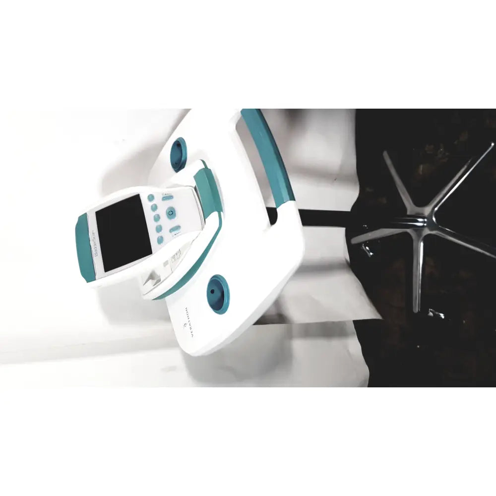 White and teal dental handpiece with digital display screen on verathon bladderscan bvi 9600 bladder scanner with rolling stand