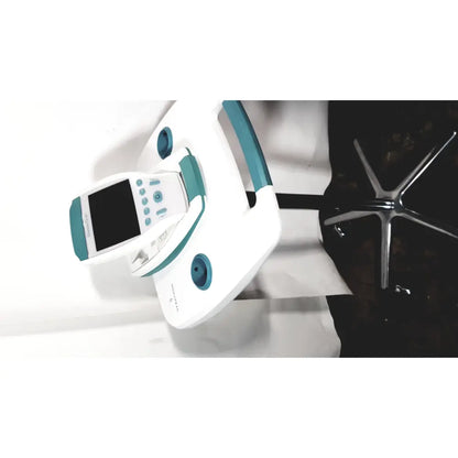 White and teal dental handpiece with digital display screen on verathon bladderscan bvi 9600 bladder scanner with rolling stand