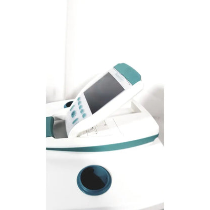 White and teal verathon bladderscan bvi 9600 bladder scanner with screen buttons circular opening on rolling stand