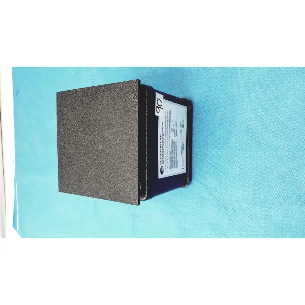 Black textured Verathon BladderScan tissue equivalent bladder phantom device with white label on its side
