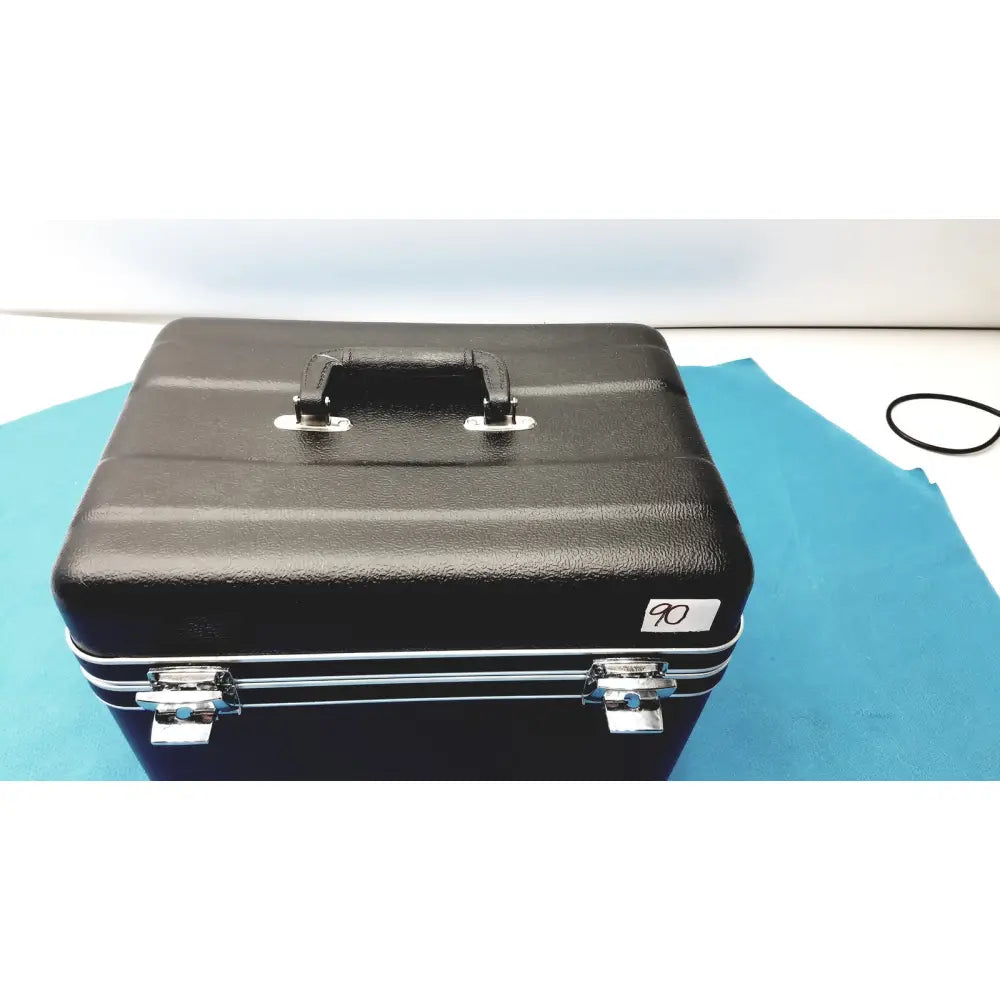 Black textured hard-shell case with silver metal latches and handle for verathon bladderscan tissue equivalent bladder phantom