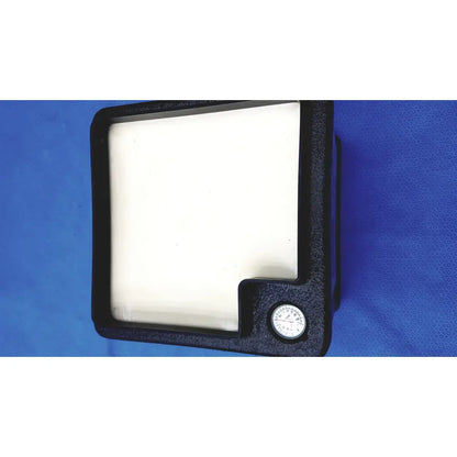 Black rectangular filter housing with white square filter and circular gauge in verathon bladderscan tissue equivalent phantom