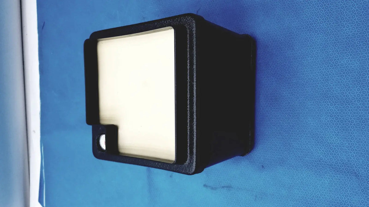Black rectangular verathon bladderscan tissue equivalent bladder phantom with white illuminated display panel and side cutout
