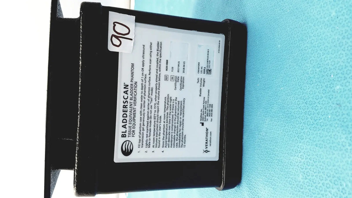 Black plastic verathon bladderscan tissue equivalent bladder phantom with white label showing instructions and specifications