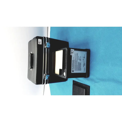 Black hard-shell carrying case with blue latches open to reveal verathon bladderscan tissue equivalent bladder phantom device inside