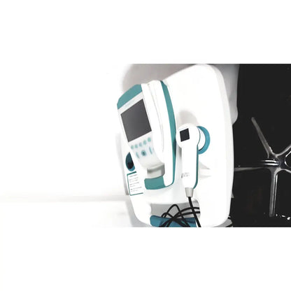 White and teal verathon bvi 9400 bladder scan ultrasound scanner with handheld transducer on wall-mounted base
