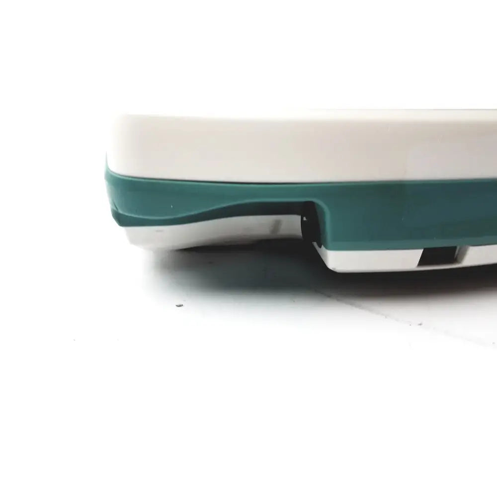 White and teal plastic base of verathon bvi 9400 bladder scanner sn-b4010970 showing back side of the bladder scanner