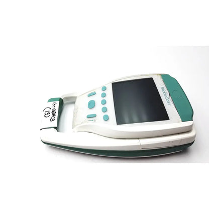 White and teal handheld glucose meter with screen and test strip slot for verathon bvi bladder scanner sn-b4010971