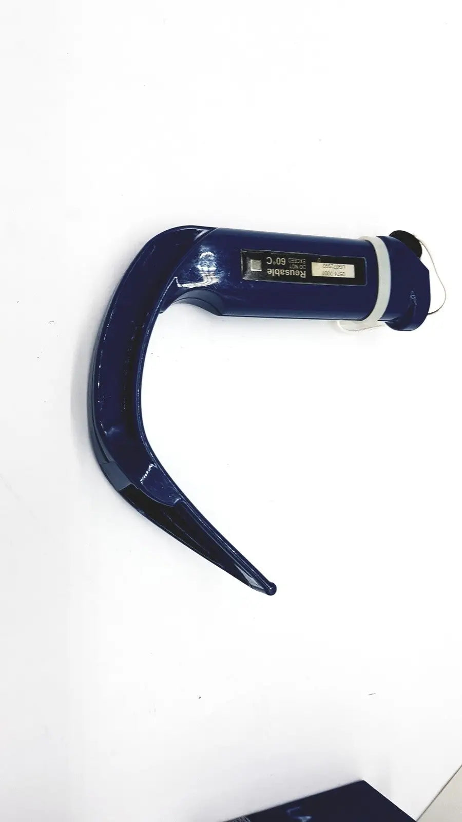 Dark blue plastic verathon glidescope reusable camera blade with curved handle and small rounded tip for otoscopy use