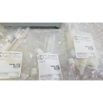 Clear plastic tubing sets in transparent packaging labeled control company for verities analyzer clinical laboratory diagnostic use