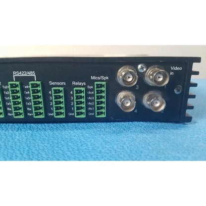 Back side of black VICONNet KTX-4 digital video encoder server with green terminal blocks and four silver bnc connectors for CCTV
