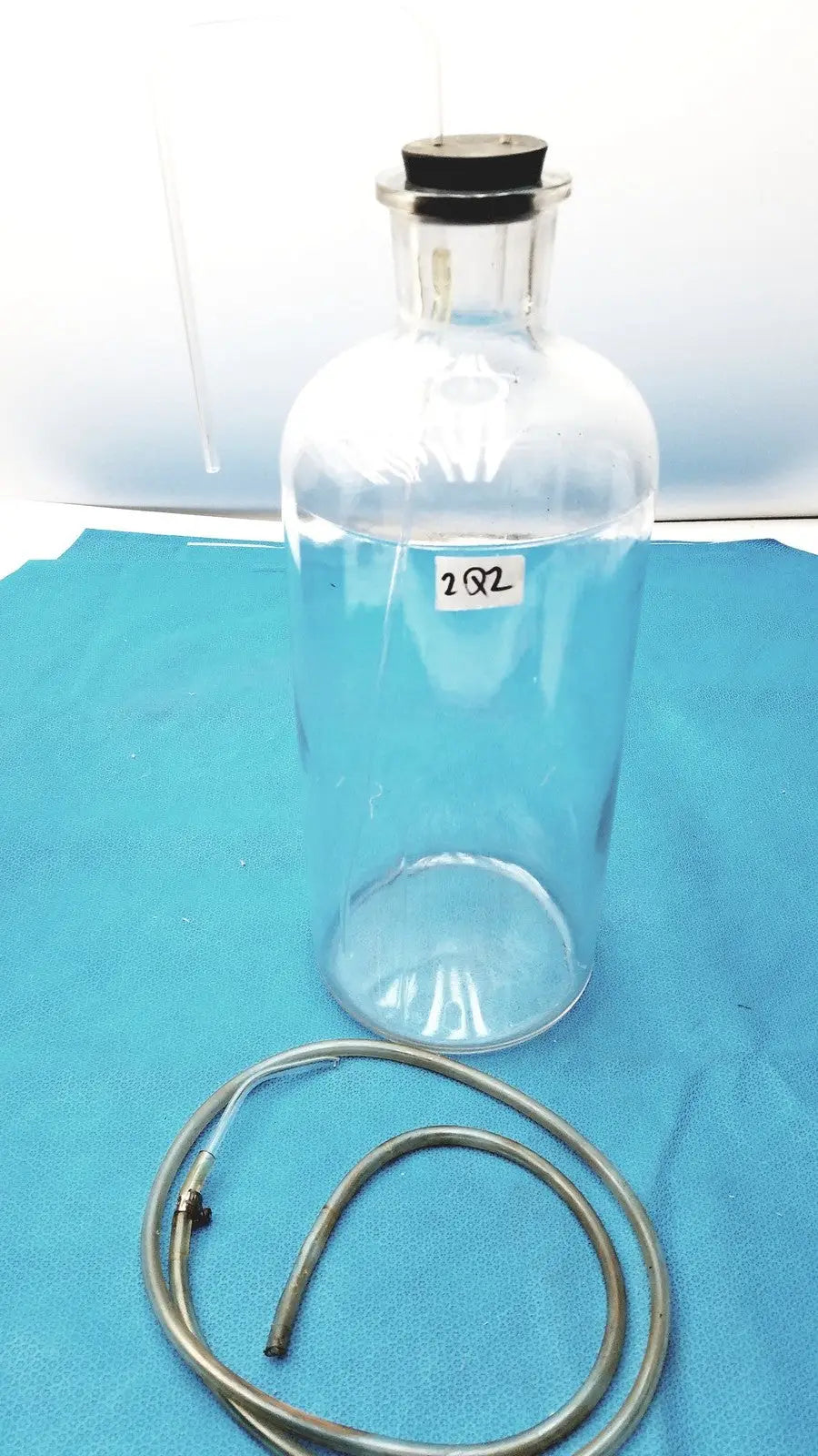 Reuse Medical Vintage 9" Clear Glass Bottle with Embossed Base – Timeless Decorative Piece Jars & Reagent Bottles, second-hand product photo 1