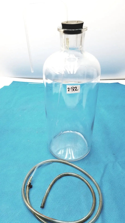 Reuse Medical Vintage 9" Clear Glass Bottle with Embossed Base – Timeless Decorative Piece Jars & Reagent Bottles, second-hand product photo 1