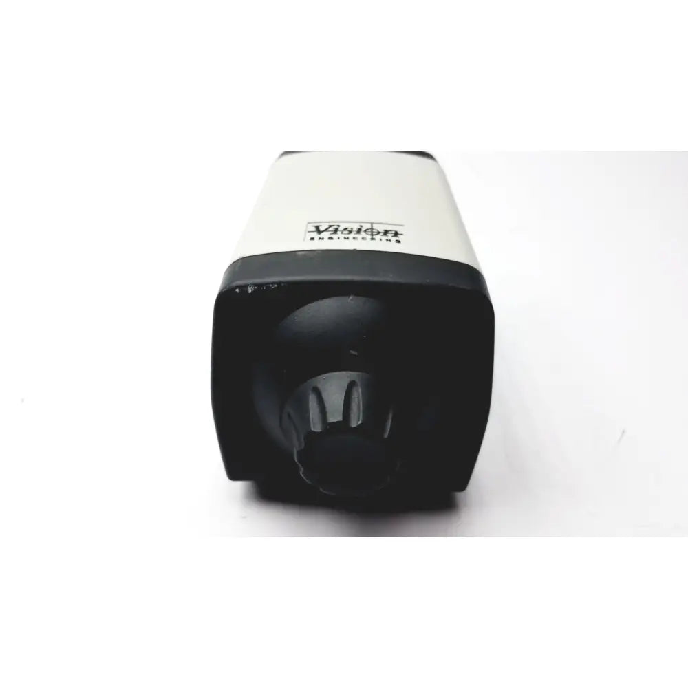 Black and white matte microscope camera head by Vision Engineering featuring cylindrical design and logo on upper section